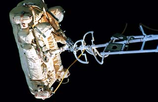 View of the Russian Manned Maneuvering Unit (MMU) in its stowed position at the end of a boom on the Kvant-2 module. 